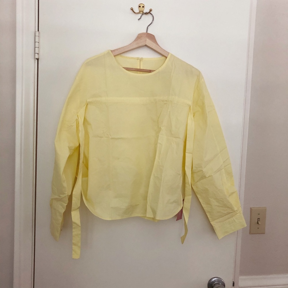 Yellow blouse.